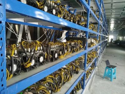 An expansive mining farm hosting multiple mining rigs